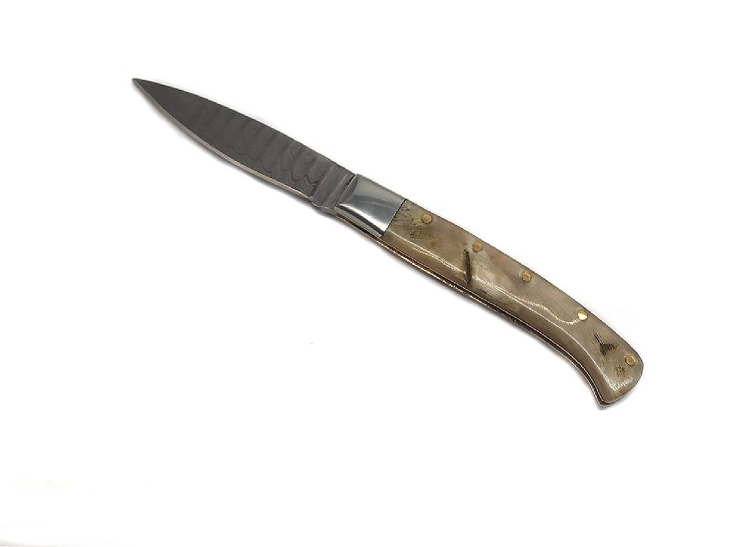 Knife made of ram horn and damask blade